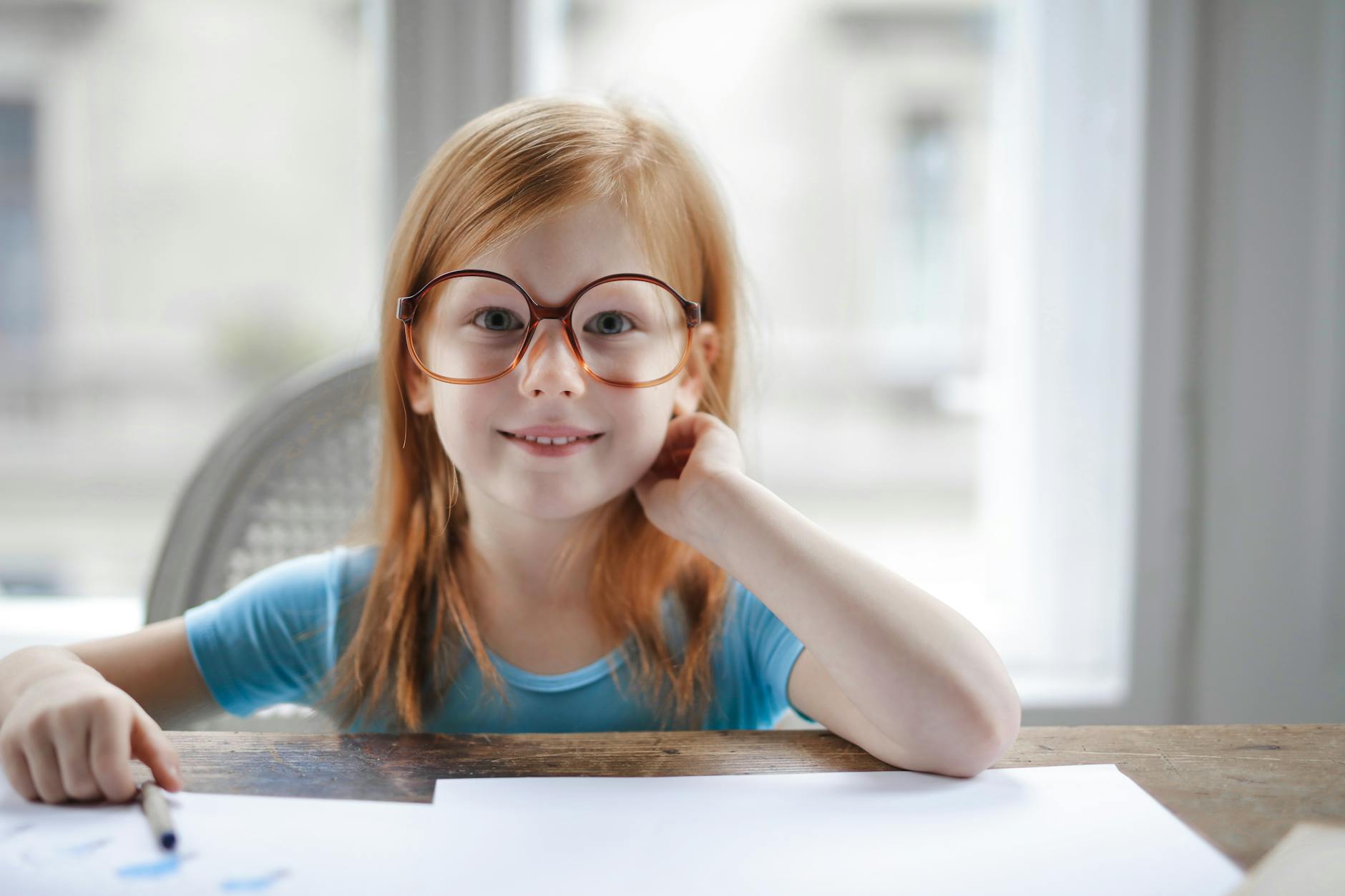 girl in blue tank top wearing eyeglasses