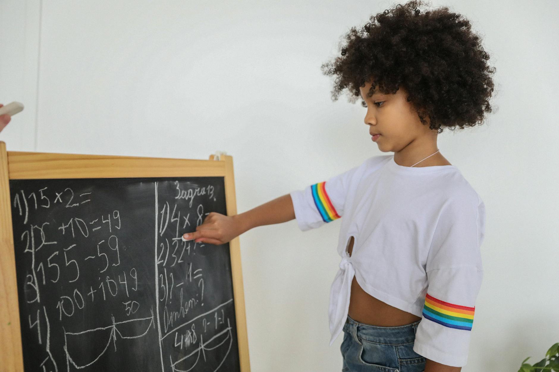 african american girl studying math at home