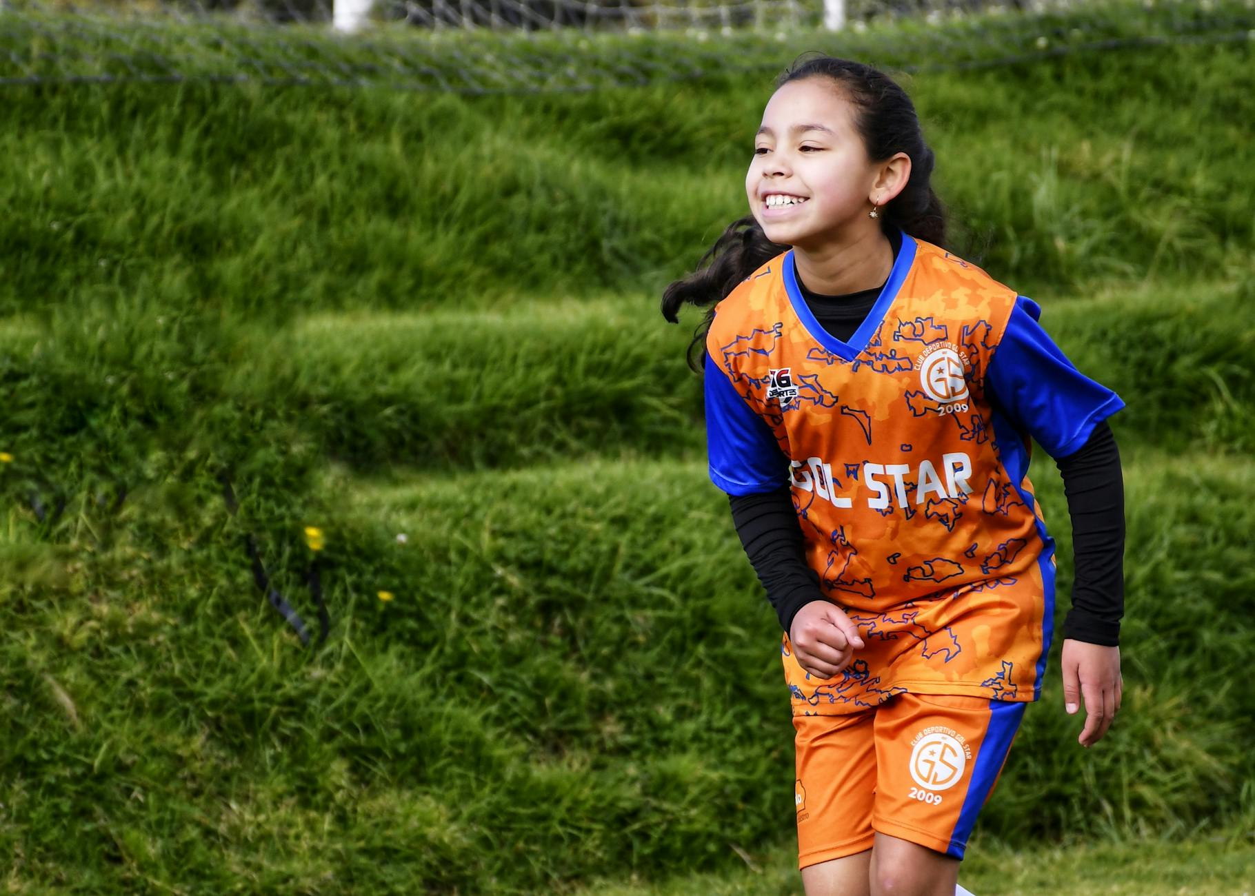 girl playing football